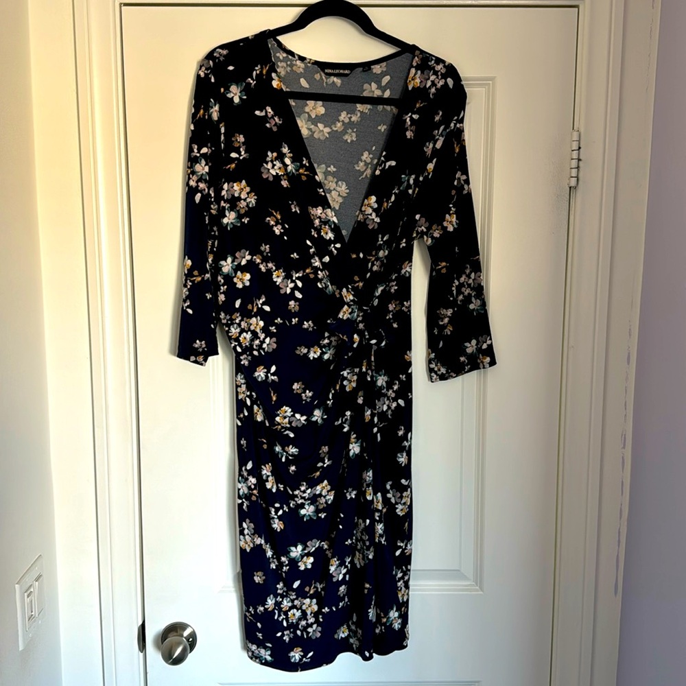 Women knee length wrap dress. Silver ring tie, three-quarter length sleeve.